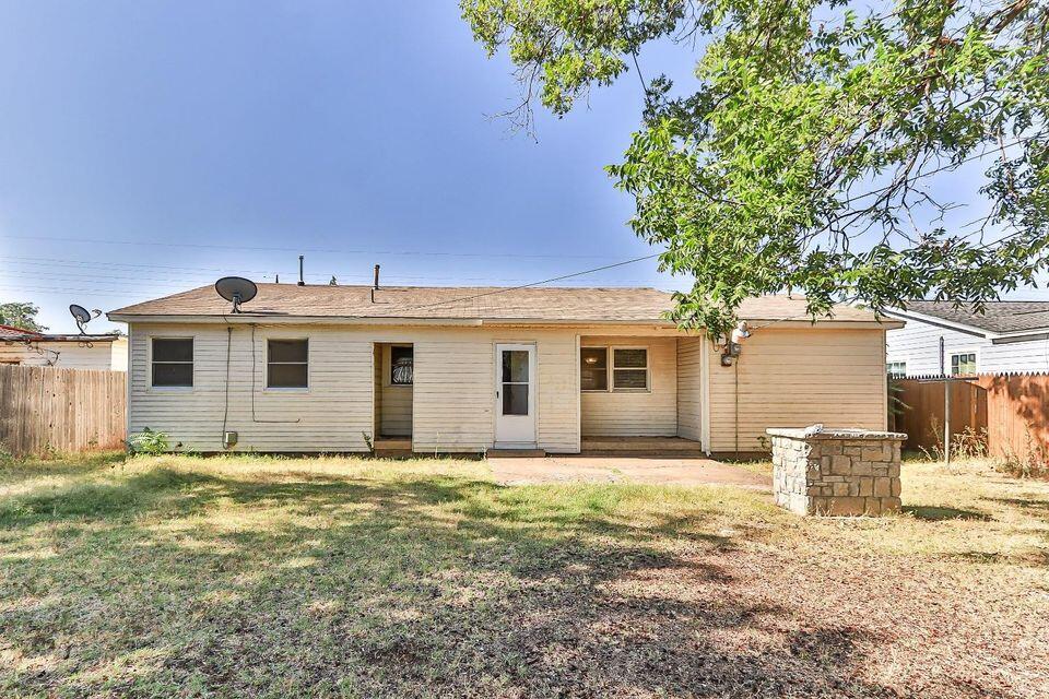 4212 42nd Street Lubbock, TX 79413 - Photo 18 of 18 a view of a house with a yard