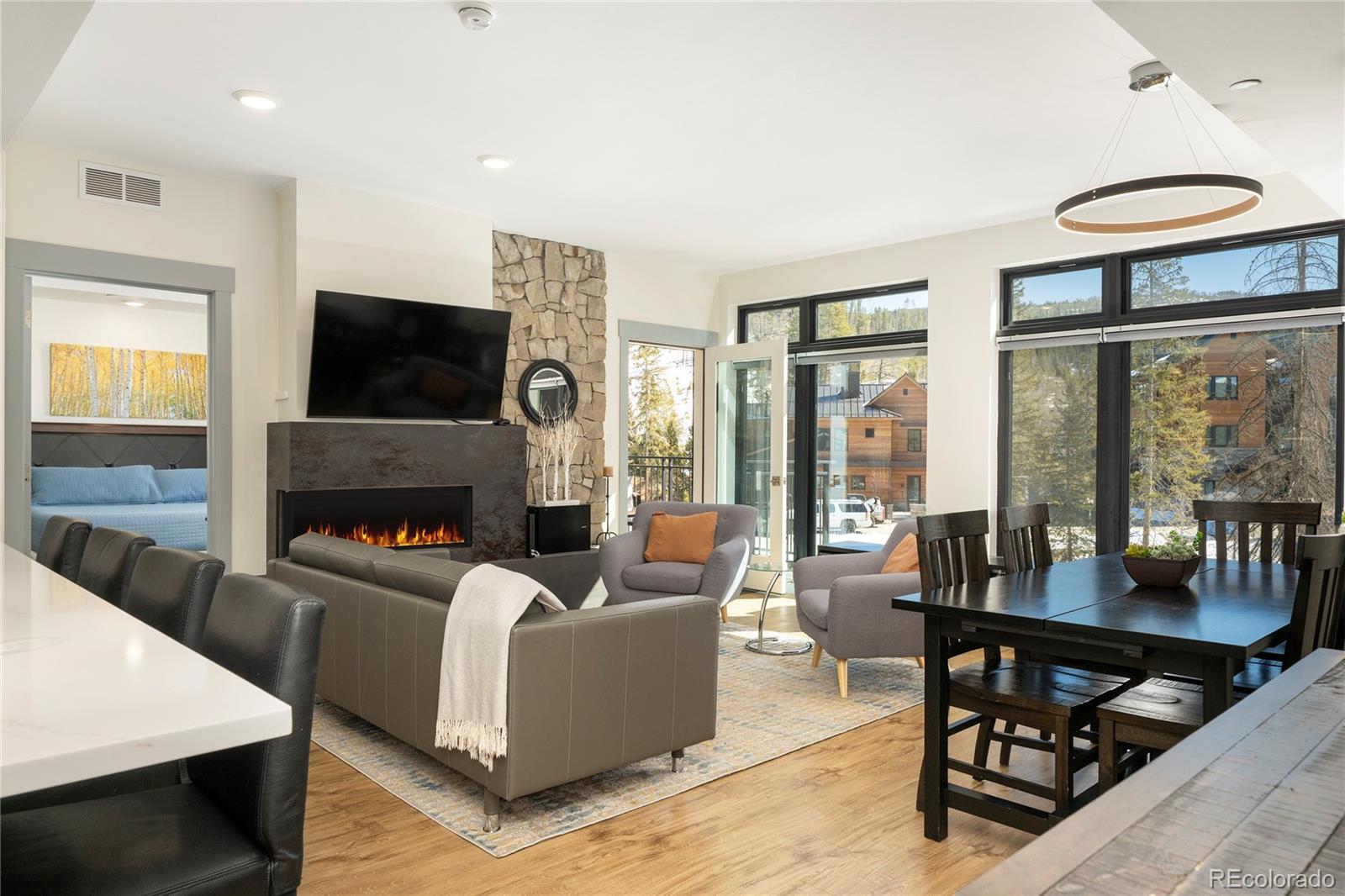 a living room with fireplace furniture and a flat screen tv