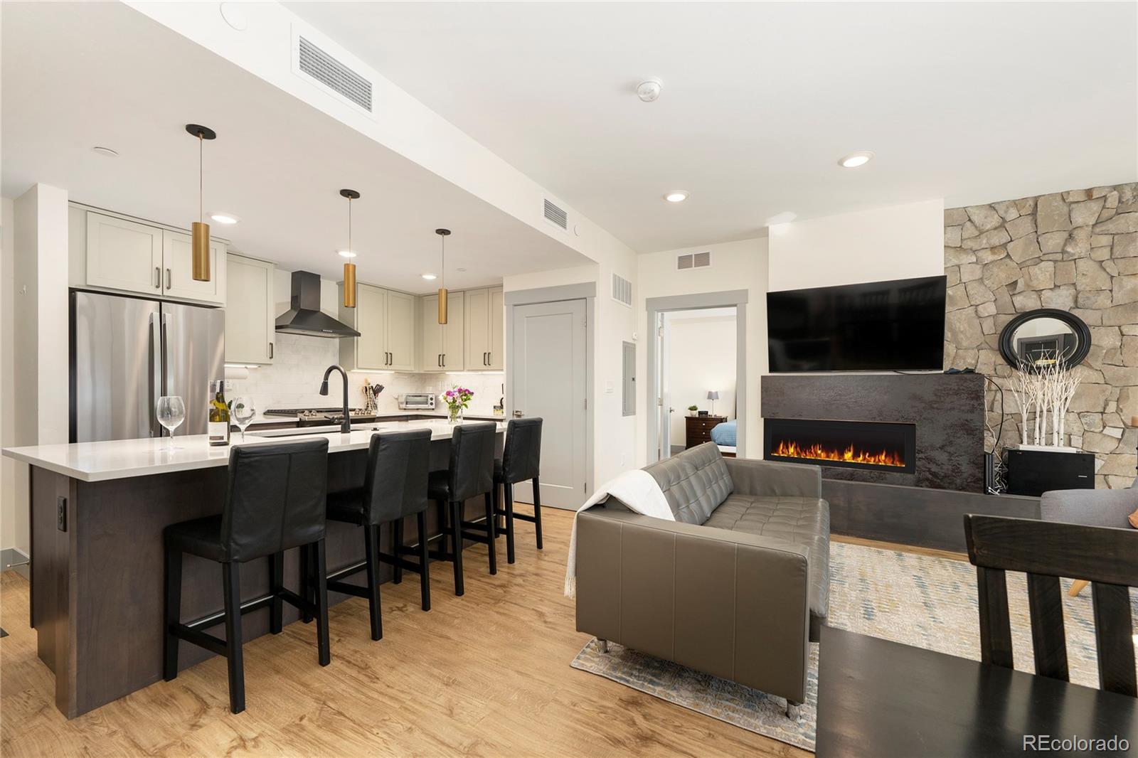 144 Ski Idlewild Road, Unit 2203 Winter Park, CO 80482 - Photo 14 of 45 a living room with stainless steel appliances furniture and a flat screen tv