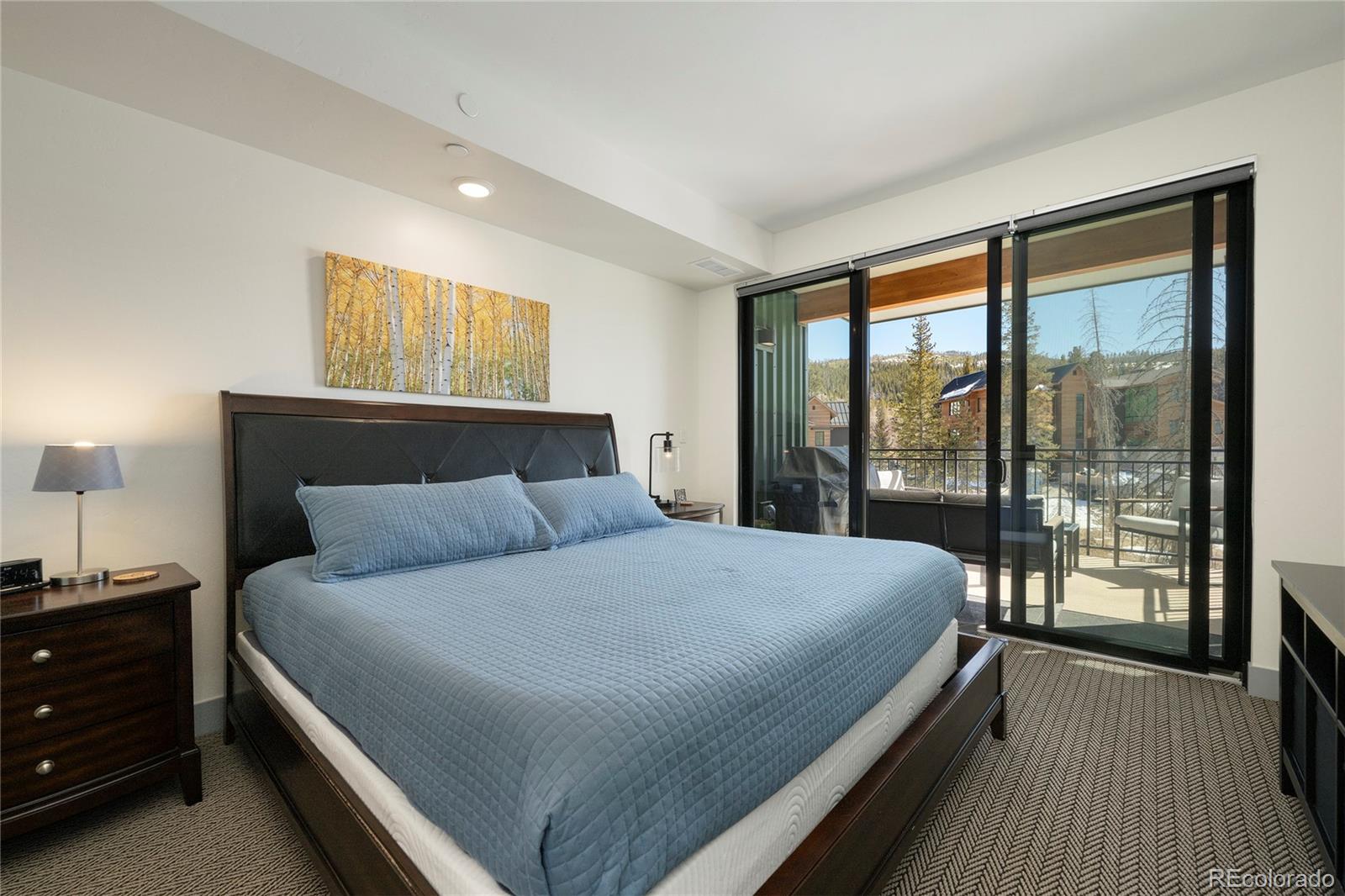 144 Ski Idlewild Road, Unit 2203 Winter Park, CO 80482 - Photo 23 of 45 a bedroom with a large bed and a large window