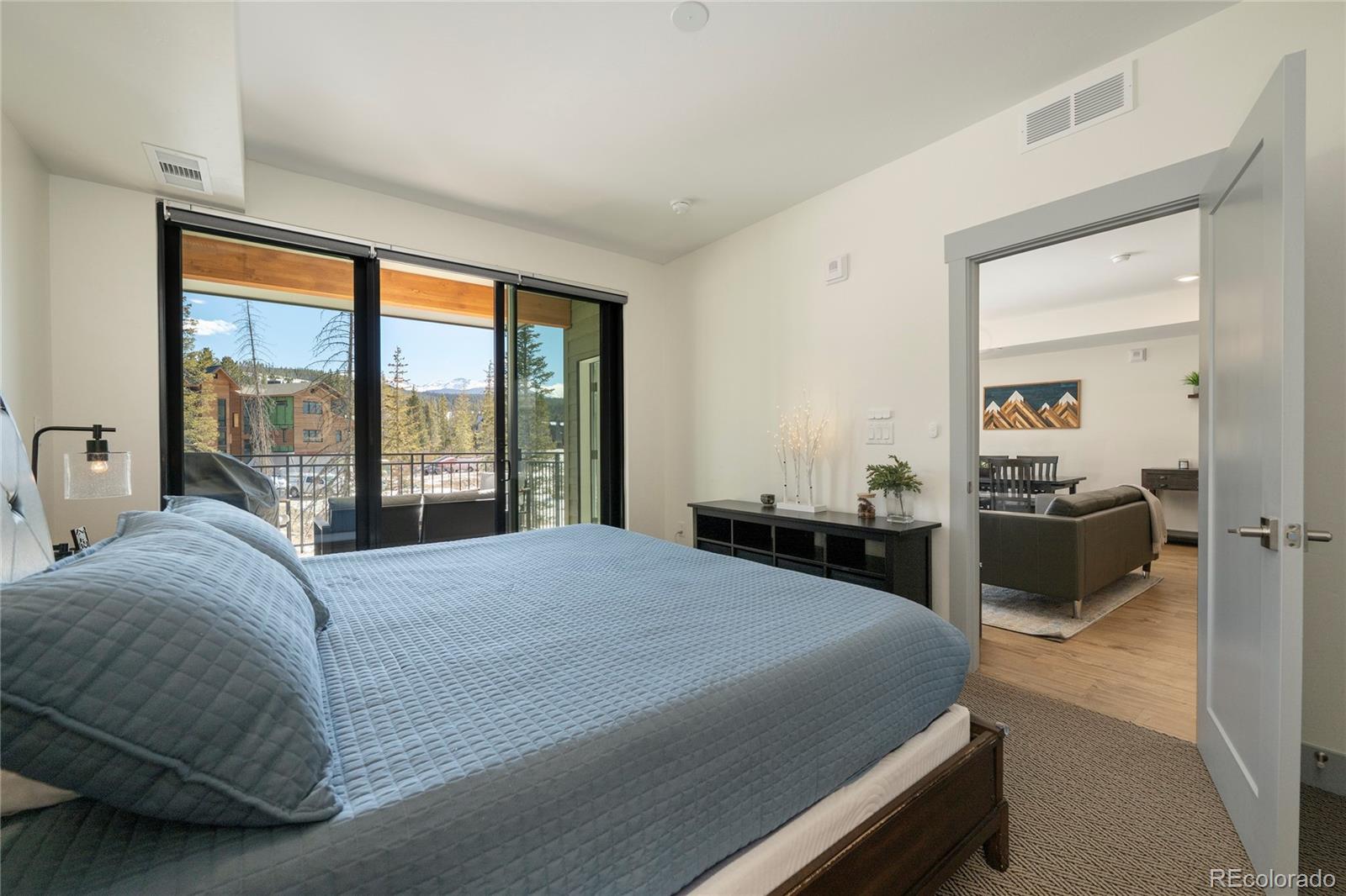 144 Ski Idlewild Road, Unit 2203 Winter Park, CO 80482 - Photo 24 of 45 a bedroom with a bed and a large window