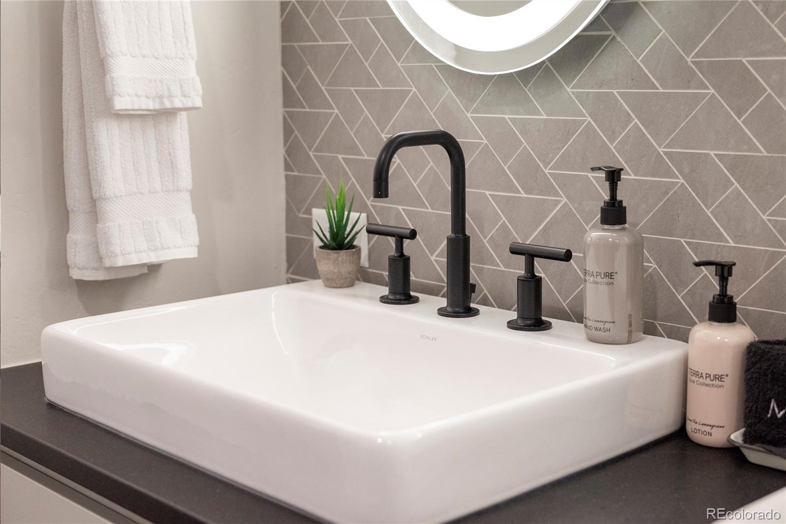 144 Ski Idlewild Road, Unit 2203 Winter Park, CO 80482 - Photo 29 of 45 a bathroom with a sink and a mirror