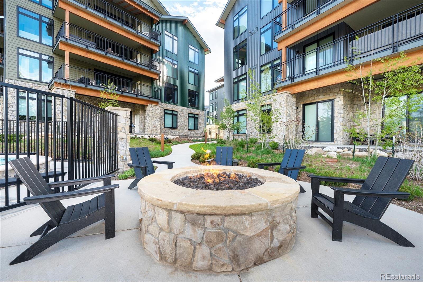 144 Ski Idlewild Road, Unit 2203 Winter Park, CO 80482 - Photo 40 of 45 a view of a patio with a table and chairs