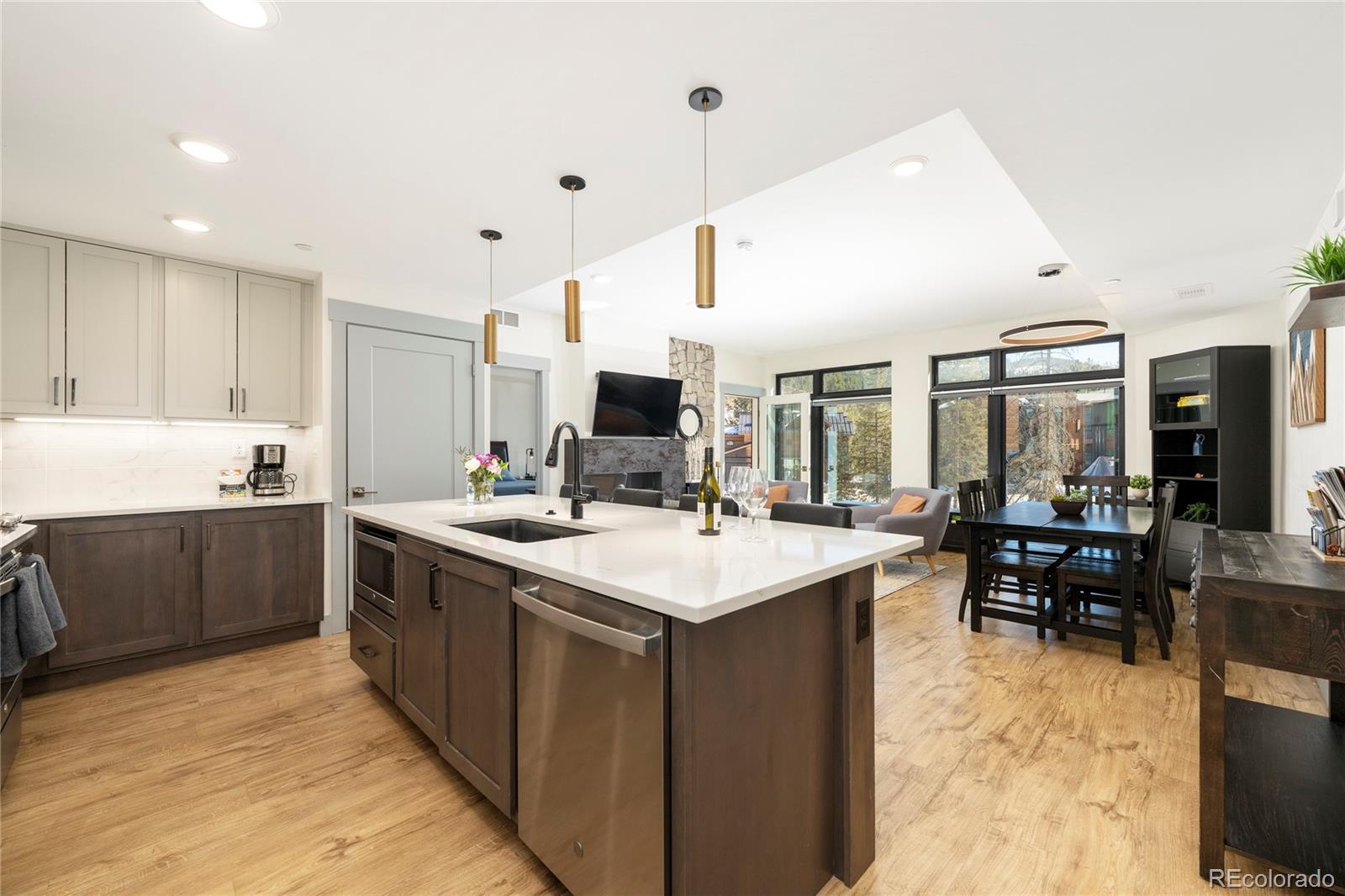 144 Ski Idlewild Road, Unit 2203 Winter Park, CO 80482 - Photo 5 of 45 a kitchen with stainless steel appliances kitchen island granite countertop a sink and cabinets