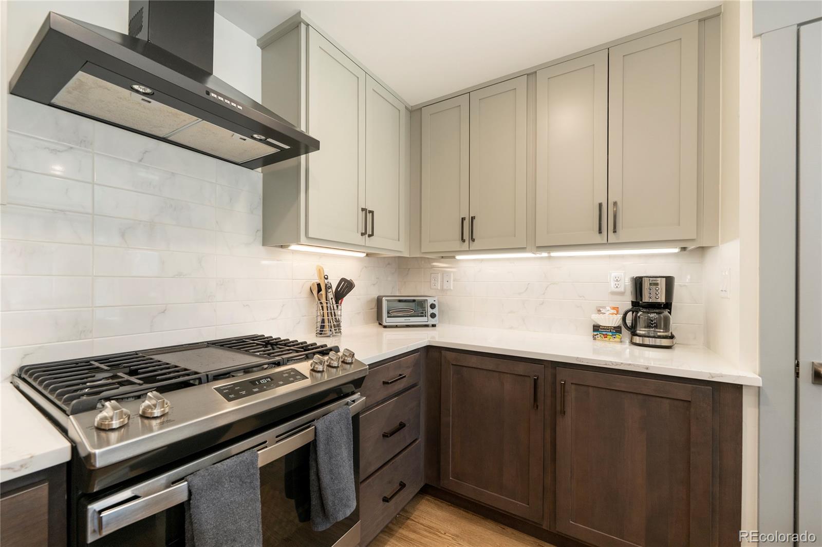 144 Ski Idlewild Road, Unit 2203 Winter Park, CO 80482 - Photo 7 of 45 a kitchen with granite countertop stainless steel appliances and cabinets