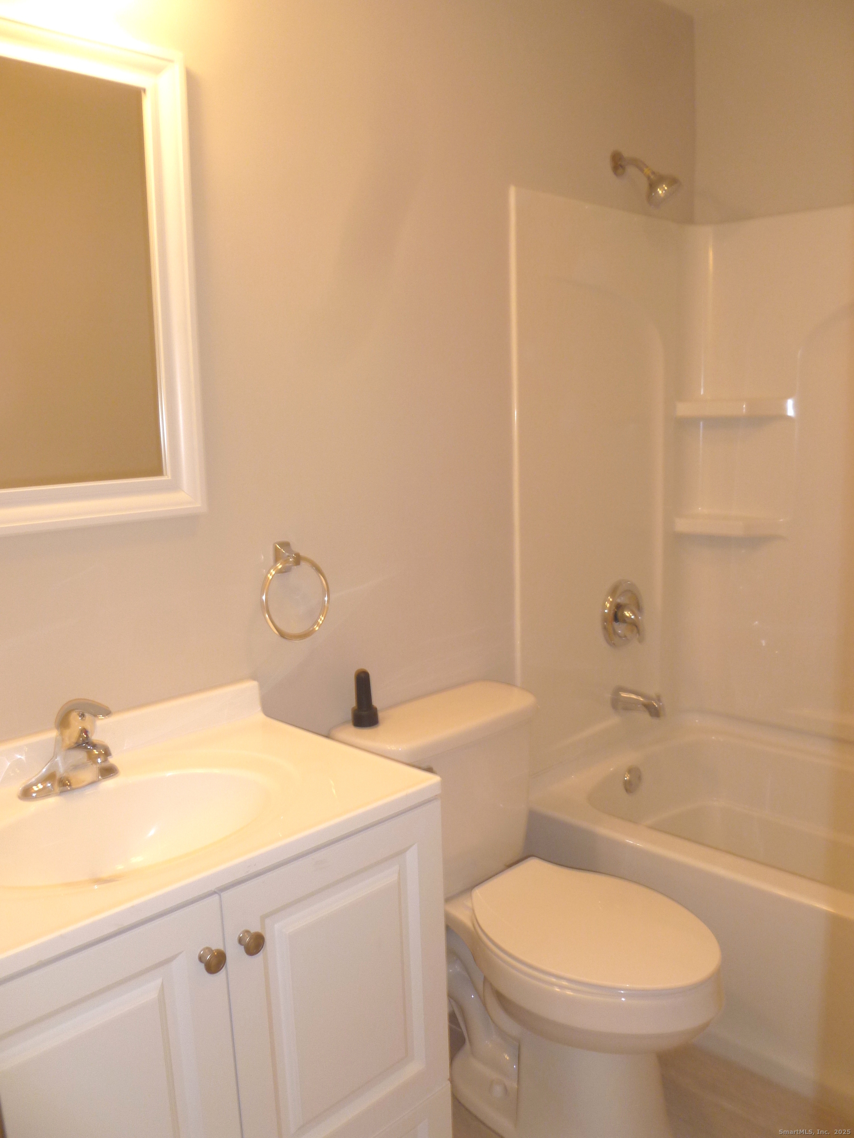 2955 Madison Avenue, Unit 46 Bridgeport, CT 06606 - Photo 13 of 29 a bathroom with a sink a toilet and shower