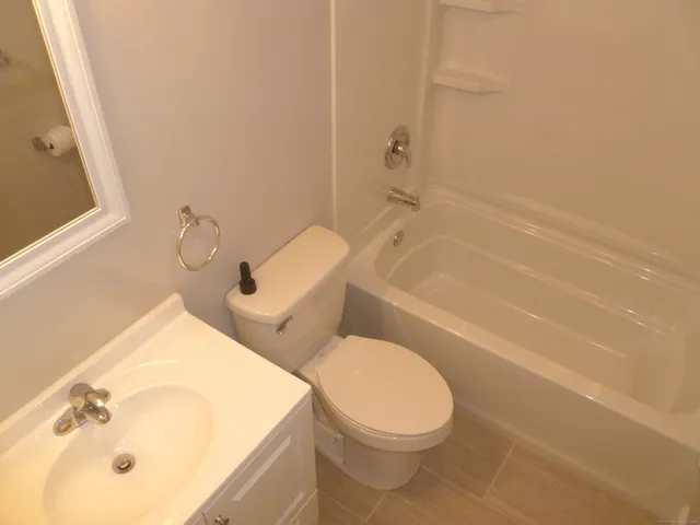 a view of a bathroom from a hallway