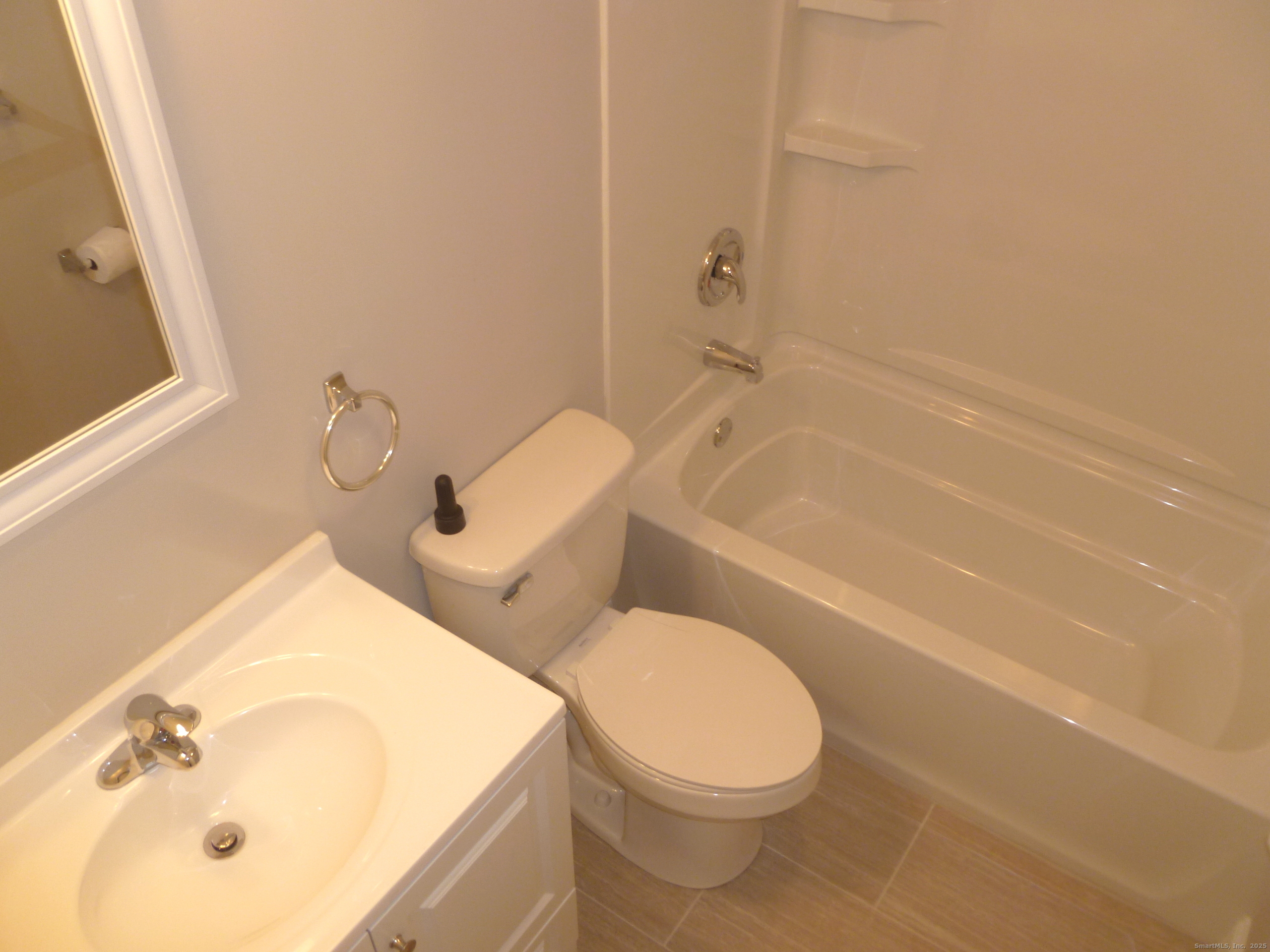 2955 Madison Avenue, Unit 46 Bridgeport, CT 06606 - Photo 14 of 29 a white toilet sitting next to a bath tub