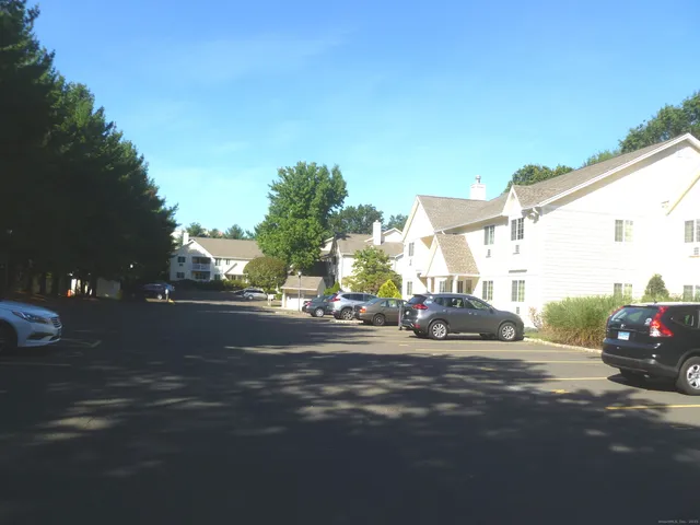 a city street lined with buildings and cars