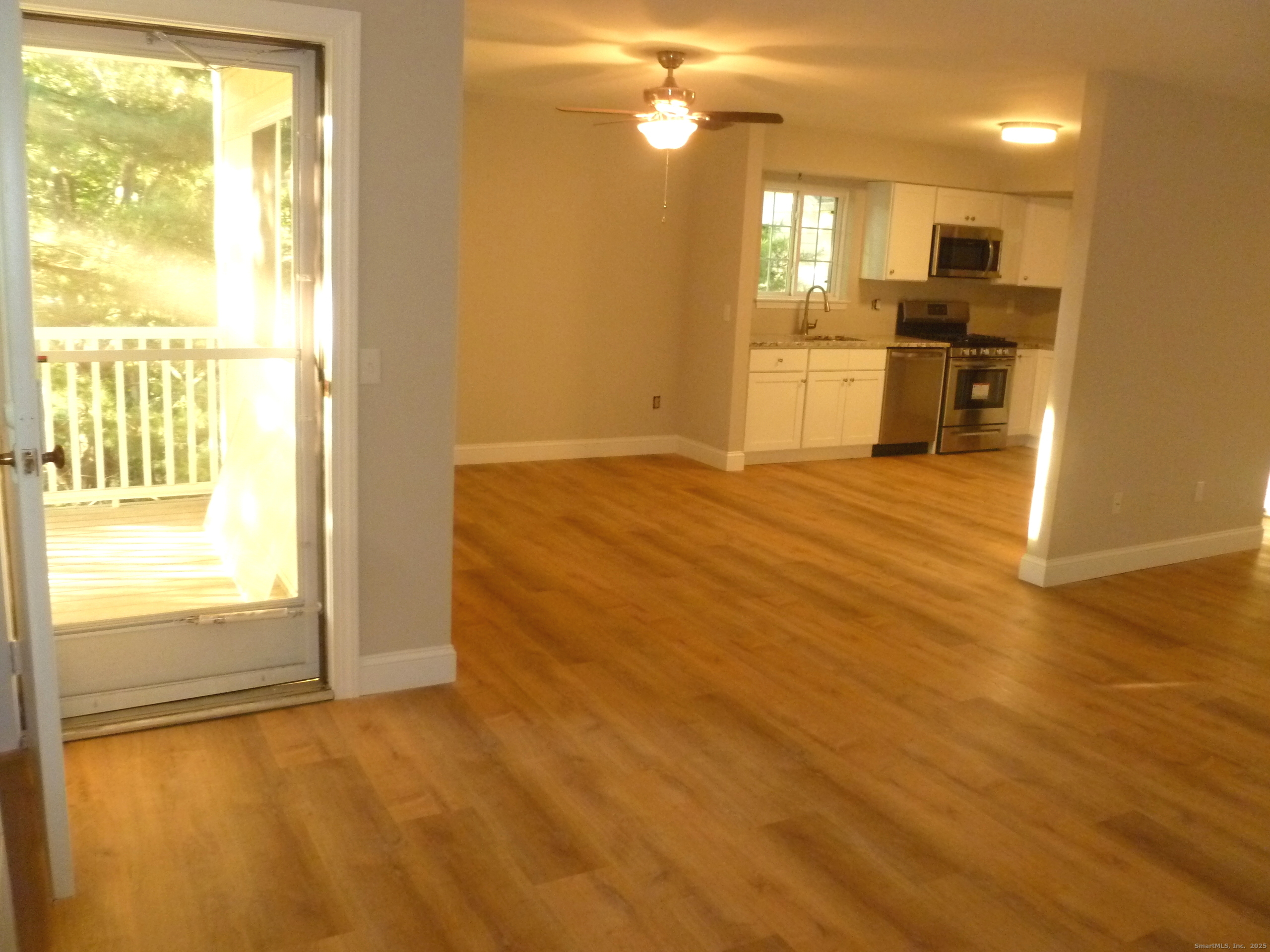 2955 Madison Avenue, Unit 46 Bridgeport, CT 06606 - Photo 3 of 29 a view of a kitchen with wooden floor and a kitchen