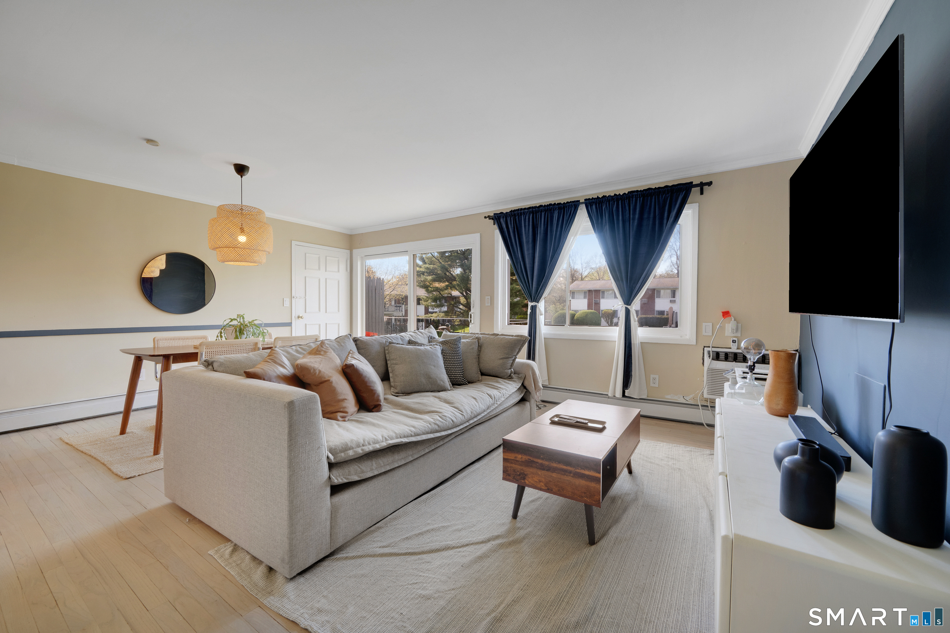 80 County Street, Unit 10F Norwalk, CT 06851 - Photo 14 of 29 a living room with furniture and a flat screen tv