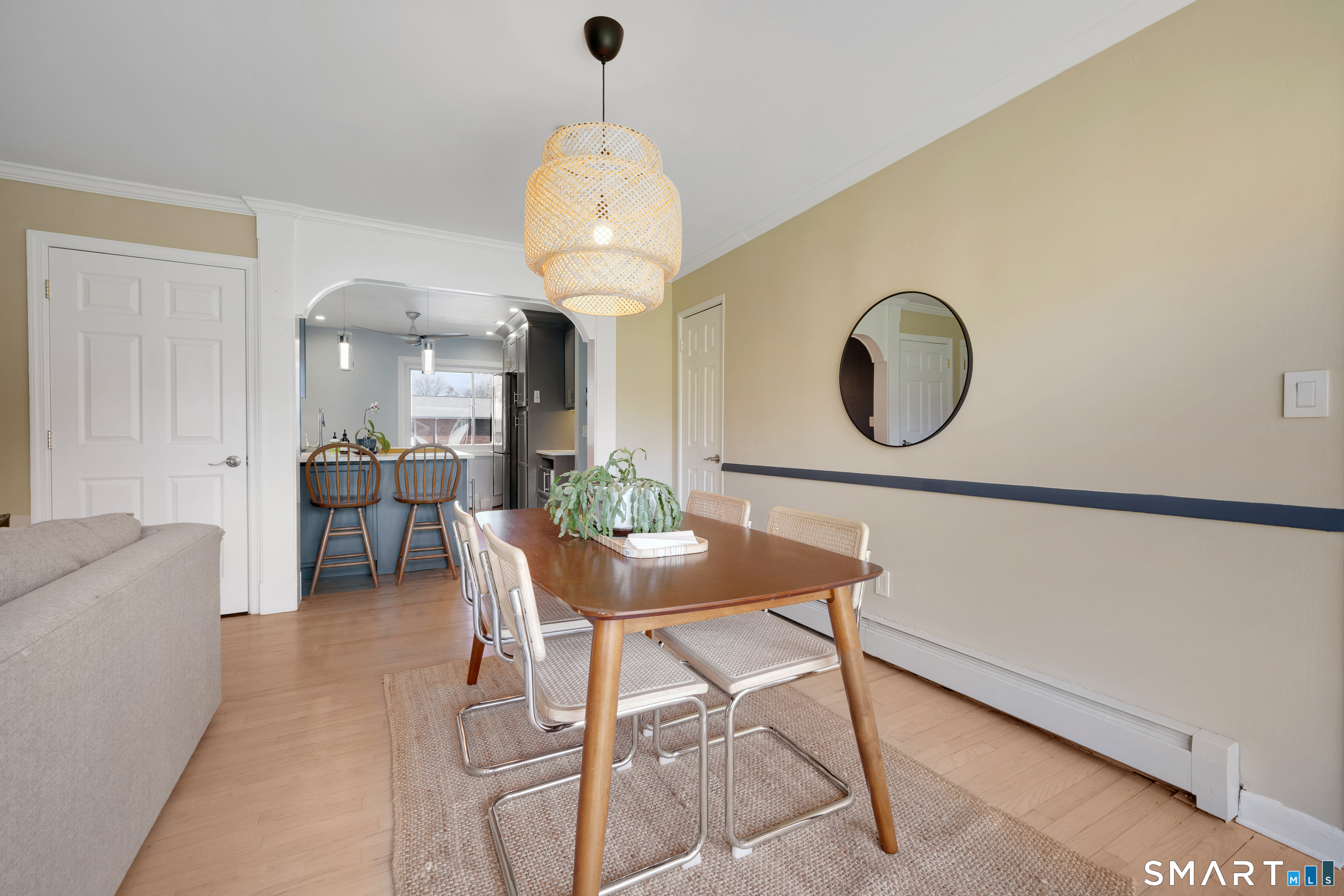 80 County Street, Unit 10F Norwalk, CT 06851 - Photo 15 of 29 a living room with furniture a mirror and a chandelier
