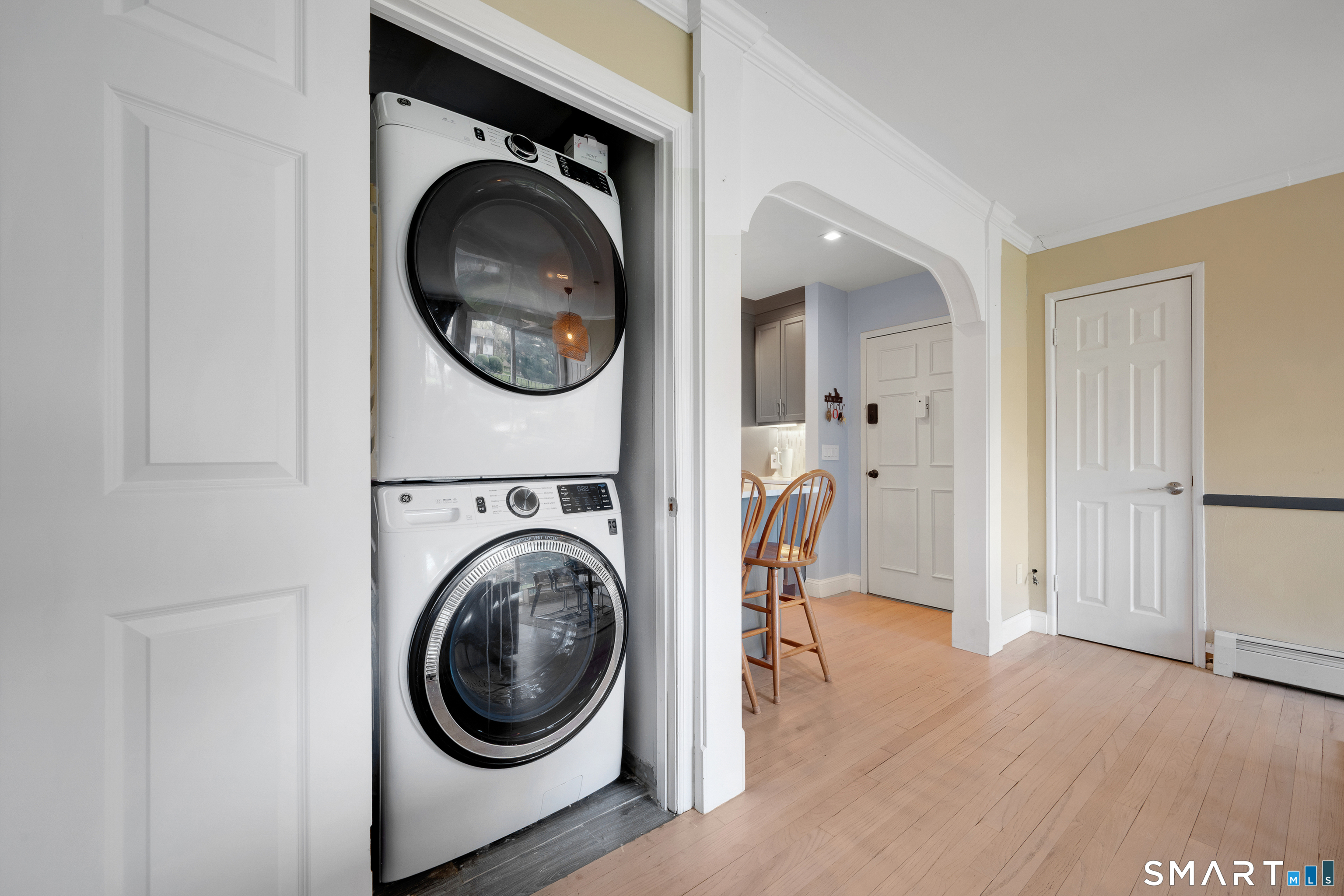 80 County Street, Unit 10F Norwalk, CT 06851 - Photo 16 of 29 a view of a hallway with washer and dryer