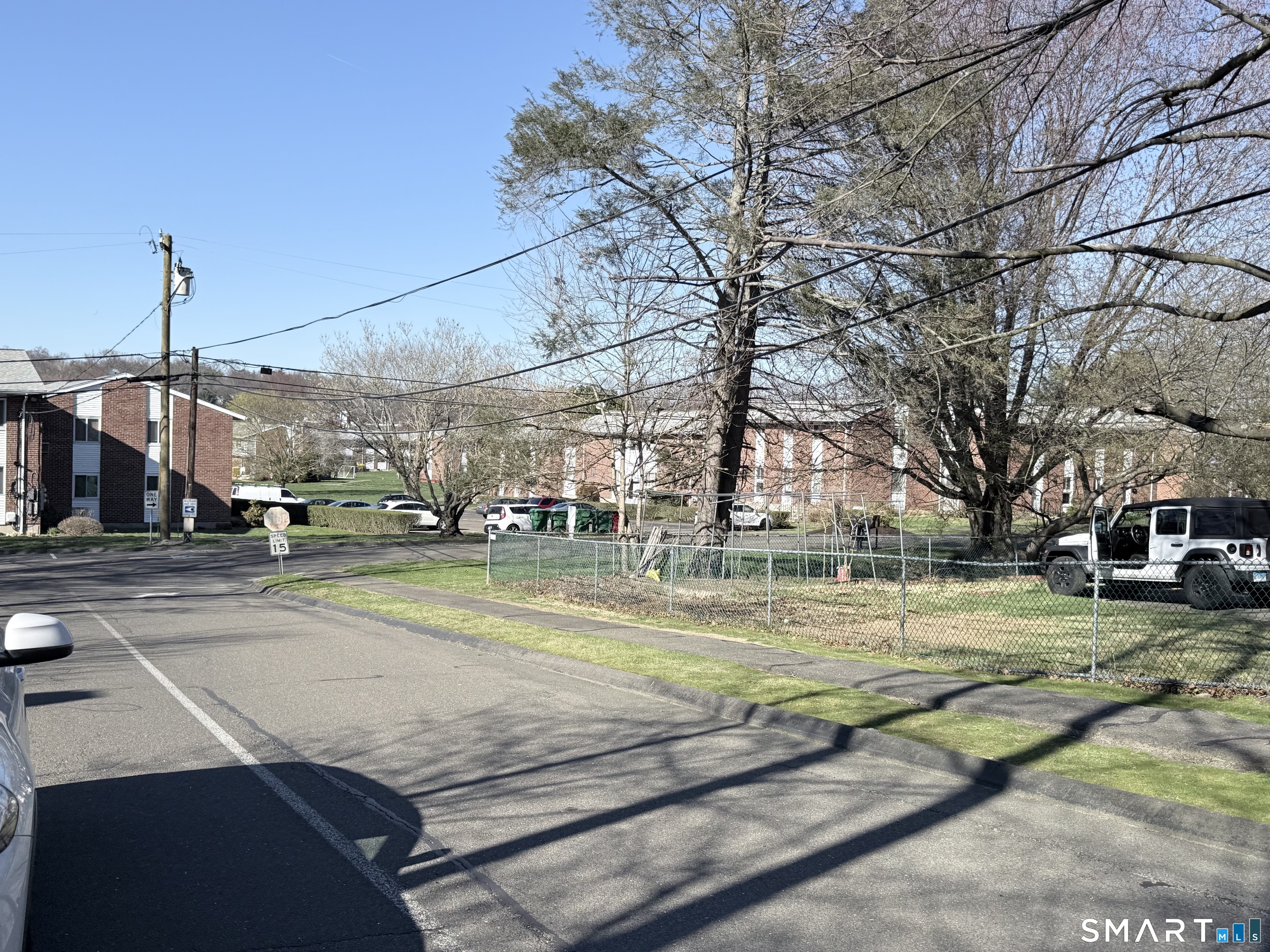 80 County Street, Unit 10F Norwalk, CT 06851 - Photo 27 of 29 a view of a swimming pool with a house in the background