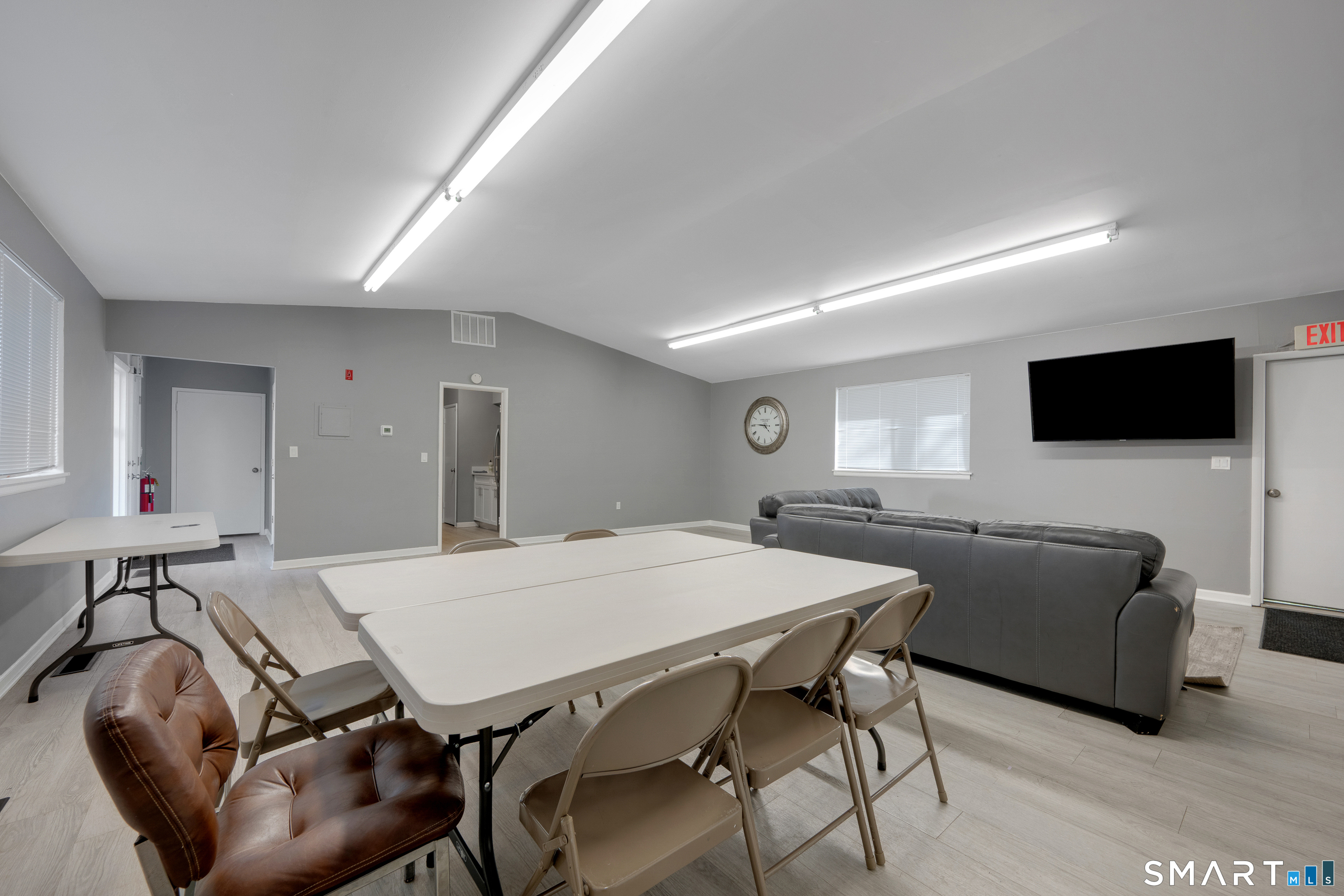 80 County Street, Unit 10F Norwalk, CT 06851 - Photo 4 of 29 a living room with furniture and a flat screen tv