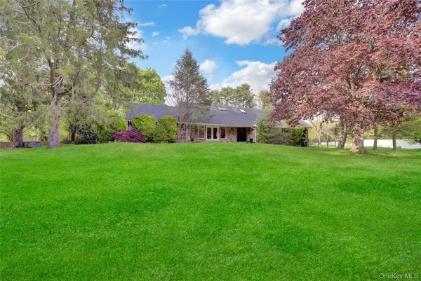 a view of a house with a big yard