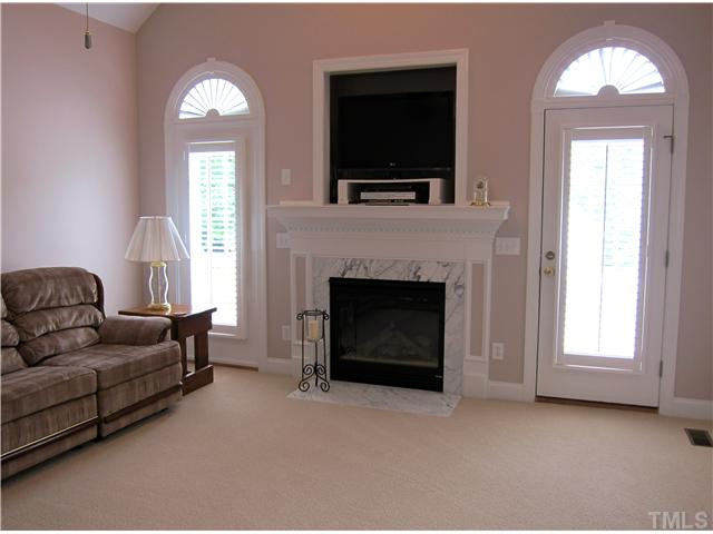 2000 Wheelerbrook Court Raleigh, NC 27603 - Photo 3 of 12 Large Great Room with Beautiful Details including the Gas Log Fireplace and Cathedral Ceiling. Den/Family/Great Room
