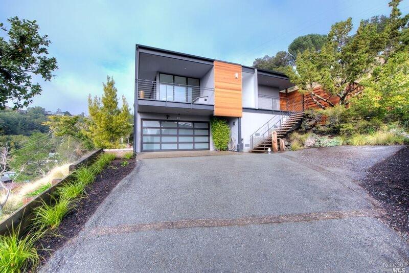 83 Cielo Drive Greenbrae, CA 94904 - Photo 1 of 1 a view of a house with a yard and garage