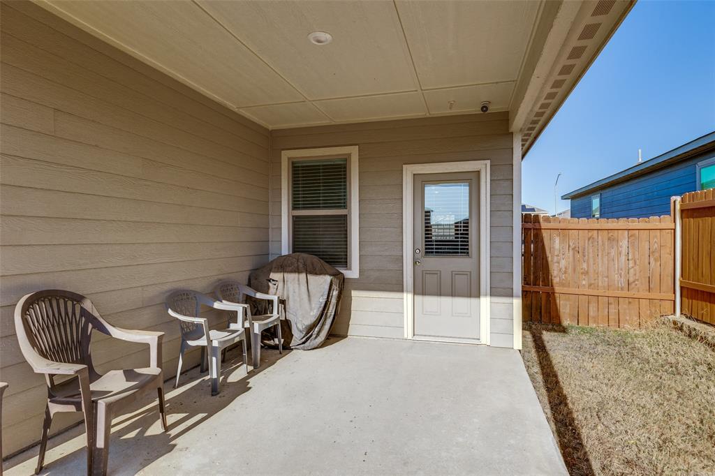 14240 Chaps Drive Dallas, TX 75253 - Photo 20 of 25 a front view of a house with outdoor seating