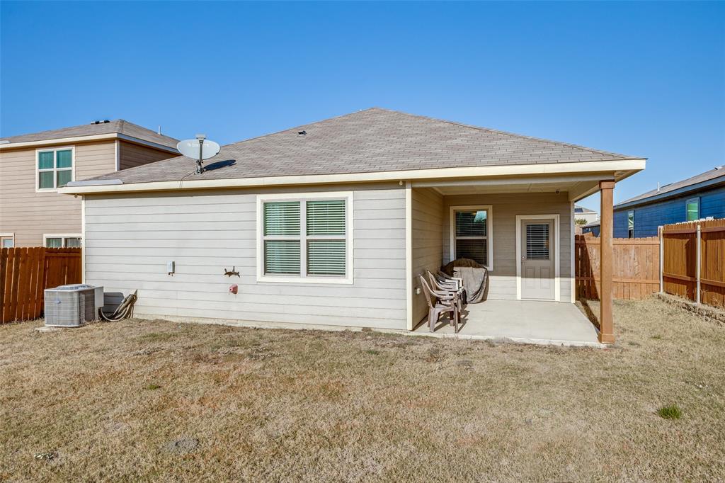14240 Chaps Drive Dallas, TX 75253 - Photo 22 of 25 a backyard of a house with seating space