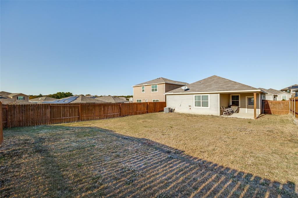 14240 Chaps Drive Dallas, TX 75253 - Photo 23 of 25 a view of a house next to a big yard