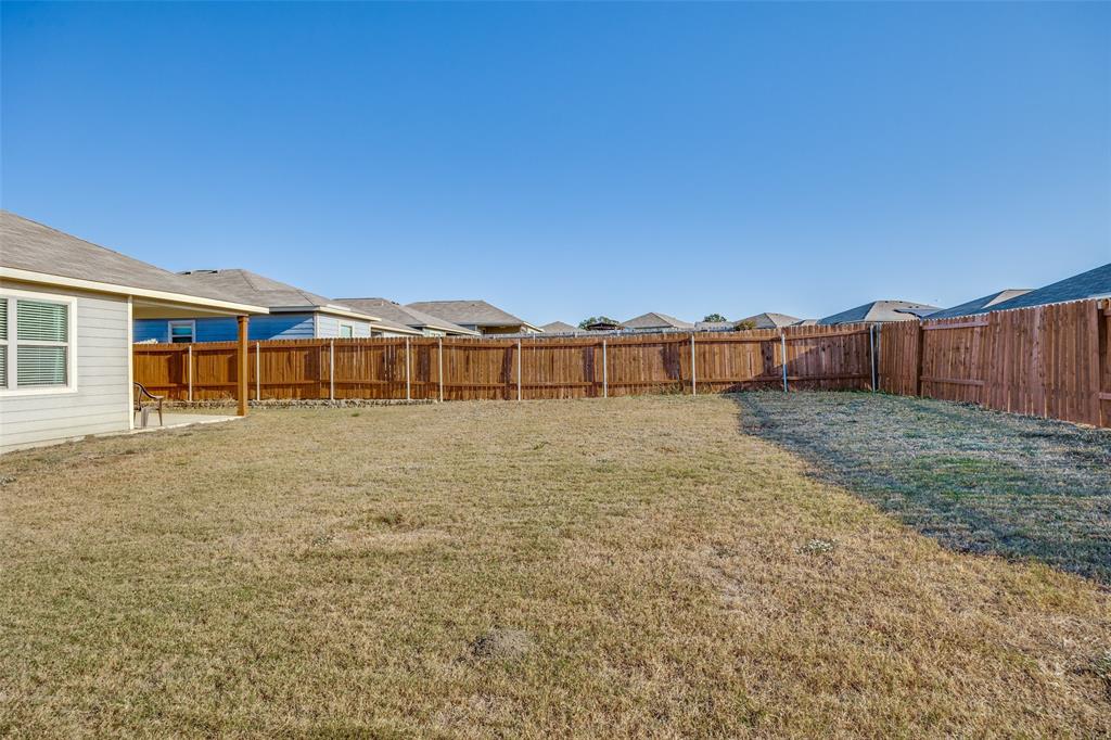14240 Chaps Drive Dallas, TX 75253 - Photo 24 of 25 a view of a house with a yard