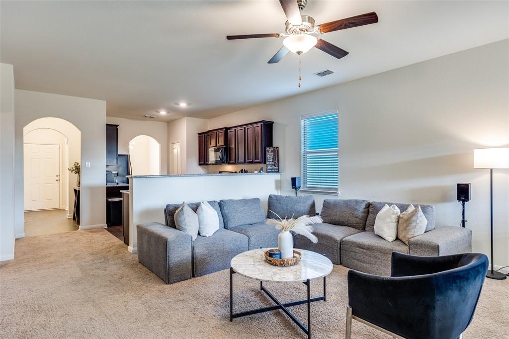 14240 Chaps Drive Dallas, TX 75253 - Photo 3 of 25 a living room with furniture and a view of kitchen