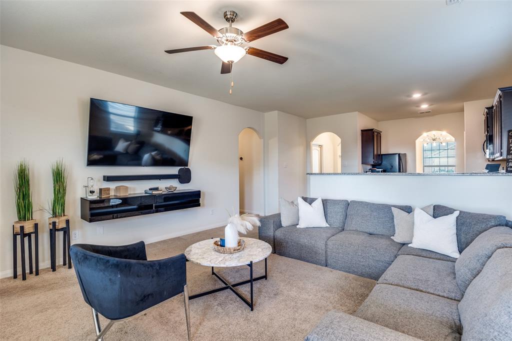14240 Chaps Drive Dallas, TX 75253 - Photo 5 of 25 a living room with furniture and a flat screen tv