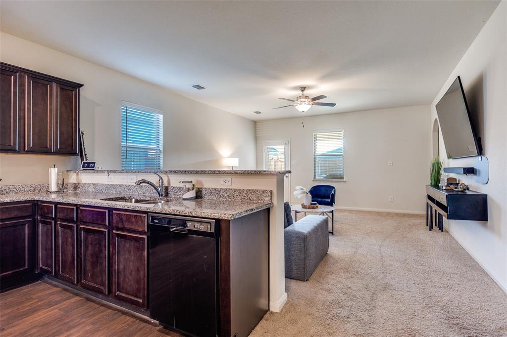14240 Chaps Drive Dallas, TX 75253 - Photo 25 of 25 a kitchen with a sink stove and cabinets