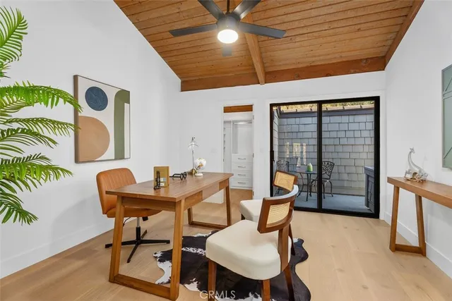 a dining room with furniture and wooden floor