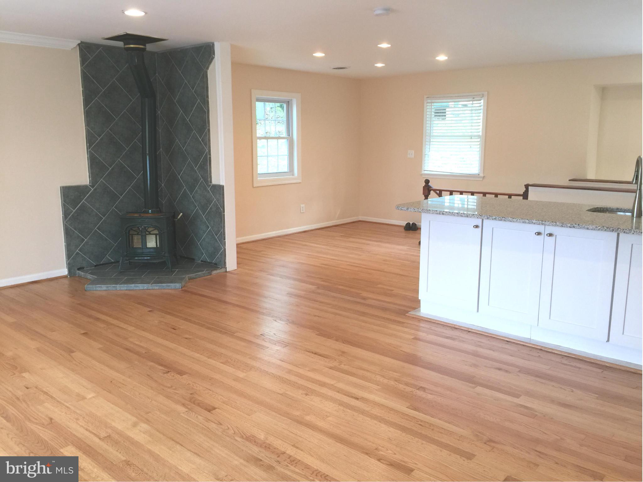 23813 Stringtown Road Clarksburg, MD 20871 - Photo 2 of 12 a view of a kitchen with wooden floor and a sink