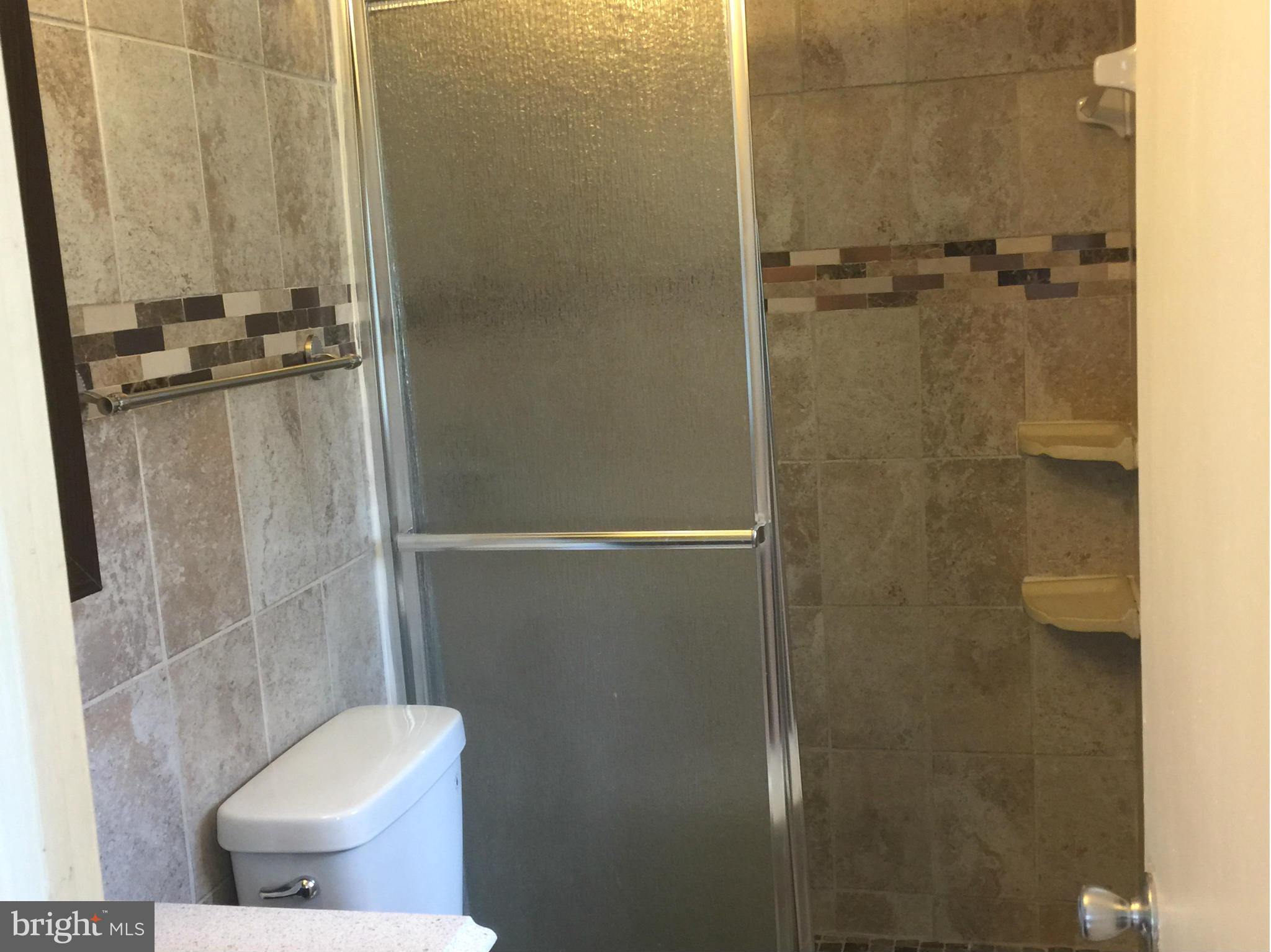 23813 Stringtown Road Clarksburg, MD 20871 - Photo 5 of 12 a bathroom with a toilet and a shower