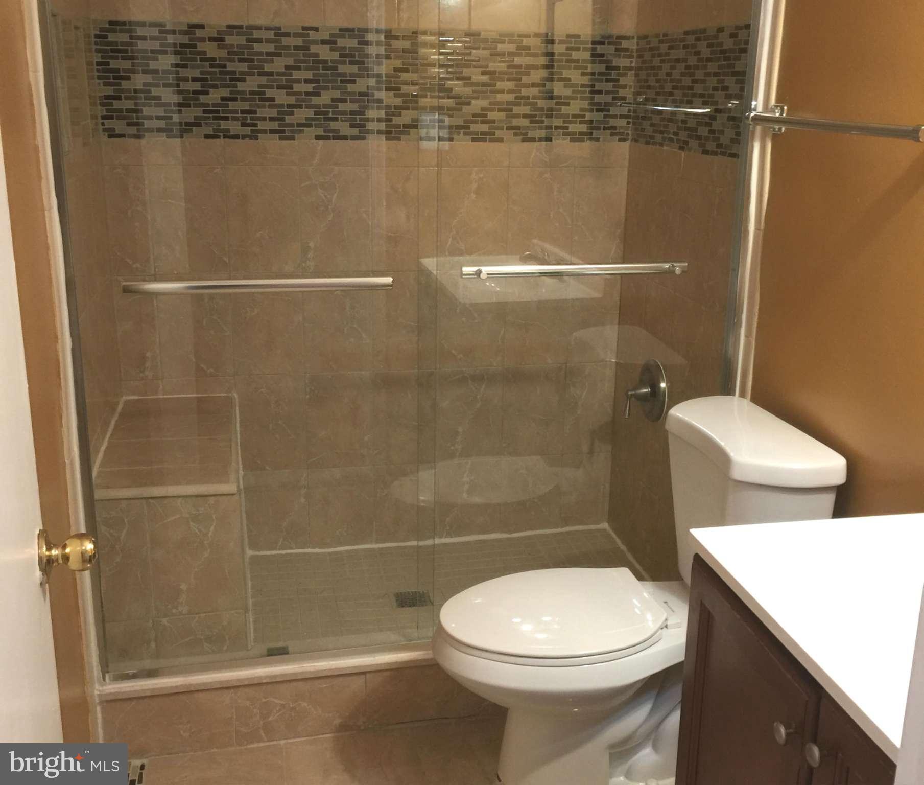 23813 Stringtown Road Clarksburg, MD 20871 - Photo 6 of 12 a bathroom with a toilet and a shower