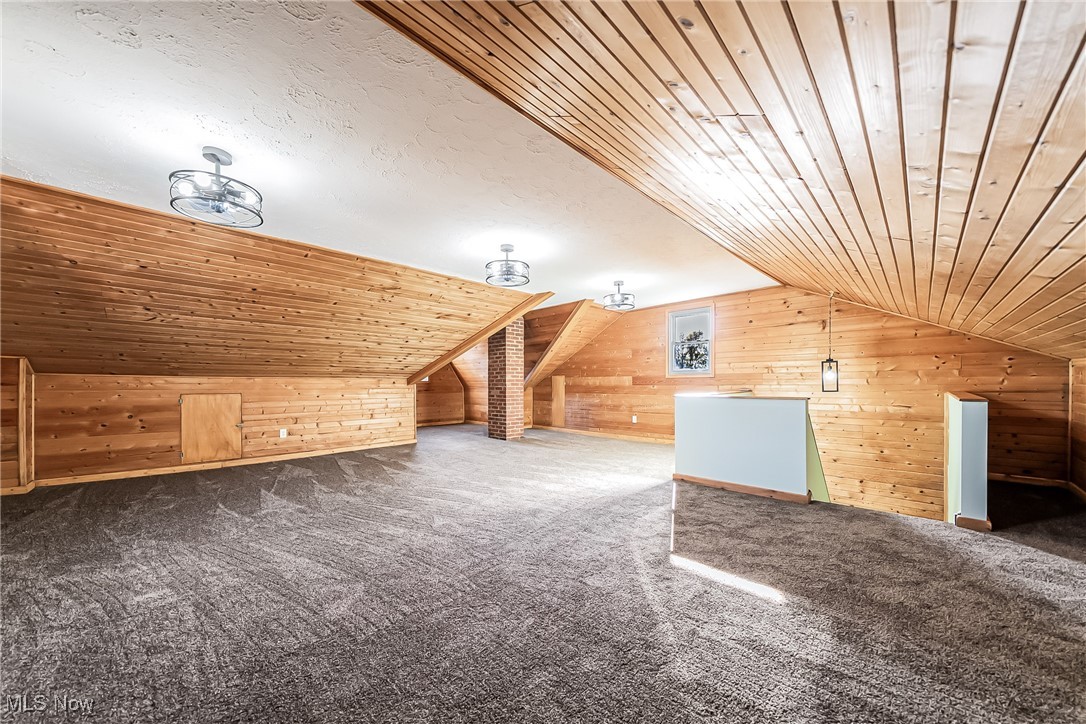 36336 Butternut Ridge Road North Ridgeville, OH 44039 - Photo 24 of 42 Additional living space with wooden walls, vaulted ceiling, carpet, and wooden ceiling