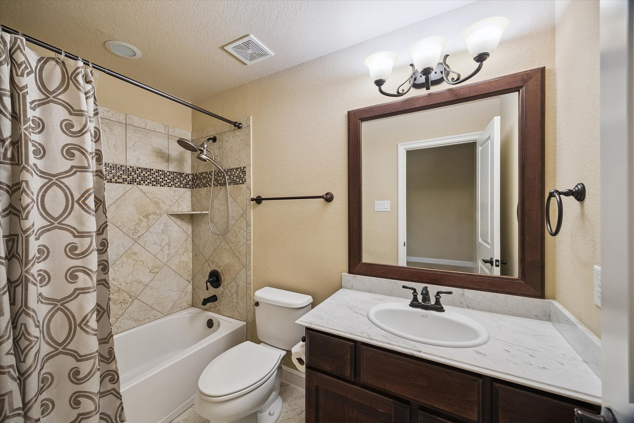 35 North Fremont Ridge Loop Spring, TX 77389 - Photo 23 of 37 This well-appointed secondary bathroom features a vanity with stone countertops, a tub/shower combination, and tasteful finishes, providing comfort and convenience for the adjoining bedroom.