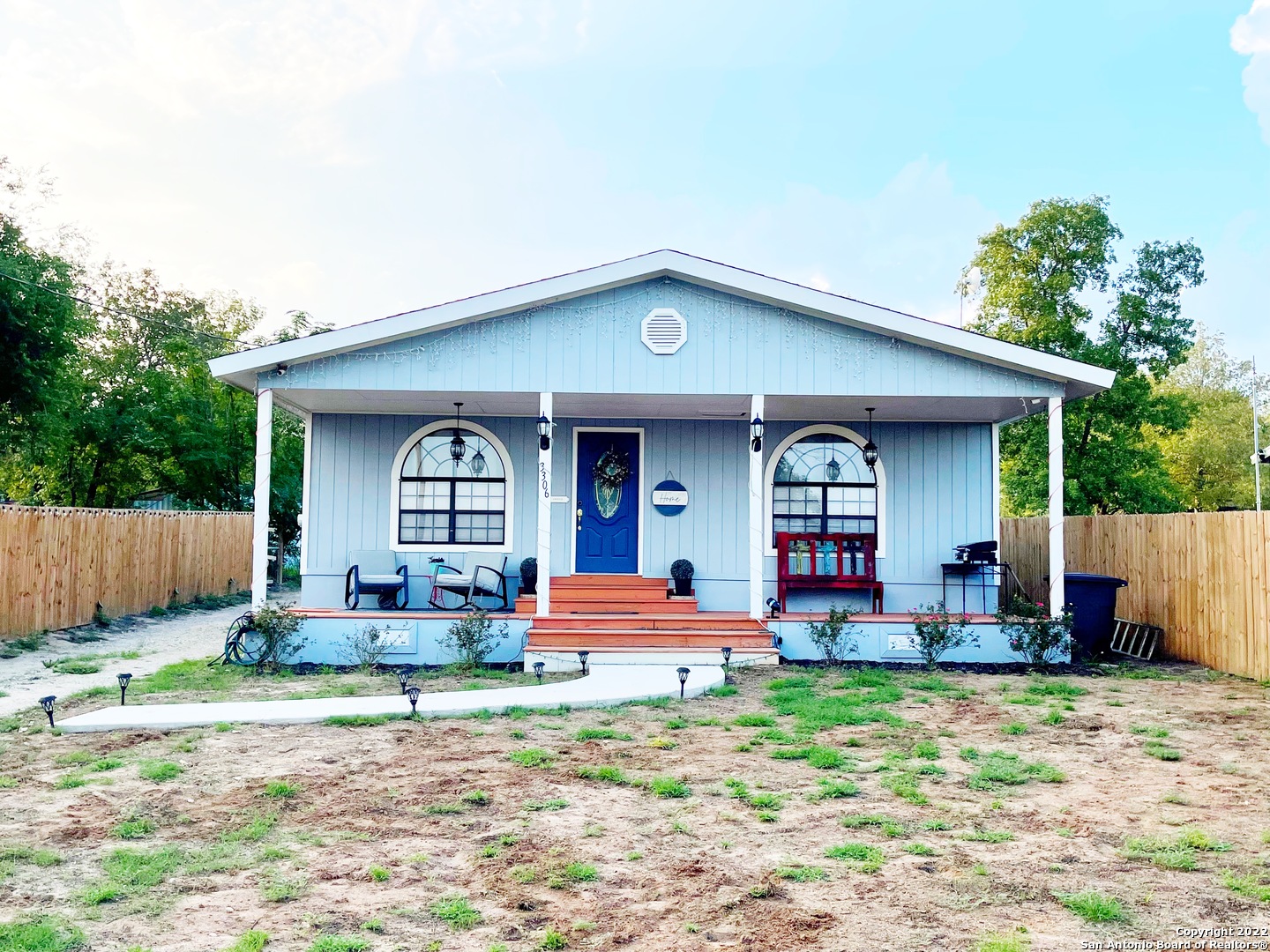 3306 Interstate 35 Natalia, TX 78059 - Photo 1 of 1 a front view of a house with garden