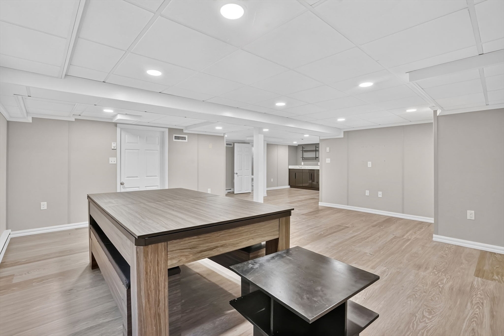 70 Dover Road Longmeadow, MA 01106 - Photo 31 of 37 a kitchen with a table a sink and a refrigerator