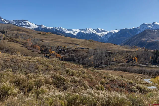 a view of a mountain view with mountains in the background