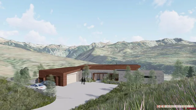 an aerial view of house with yard and ocean view