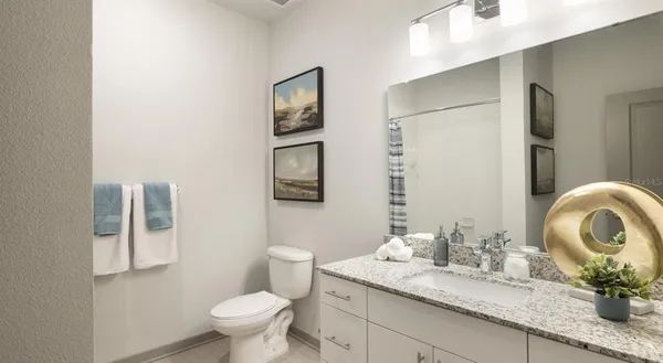 a utility room with a shower and a glass door