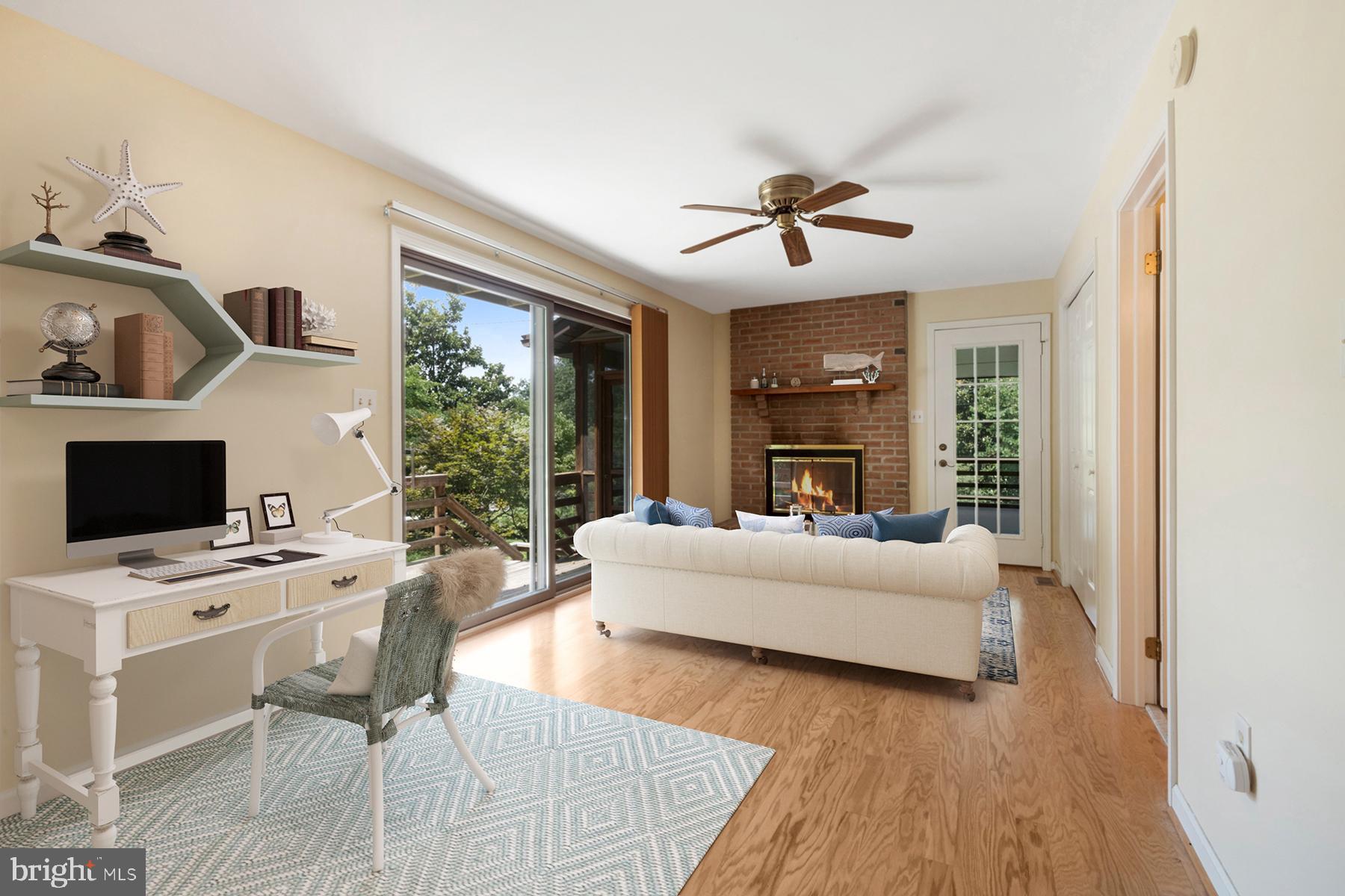 1190 Cavalier Road Arnold, MD 21012 - Photo 11 of 37 Family room has a wood burning fireplace