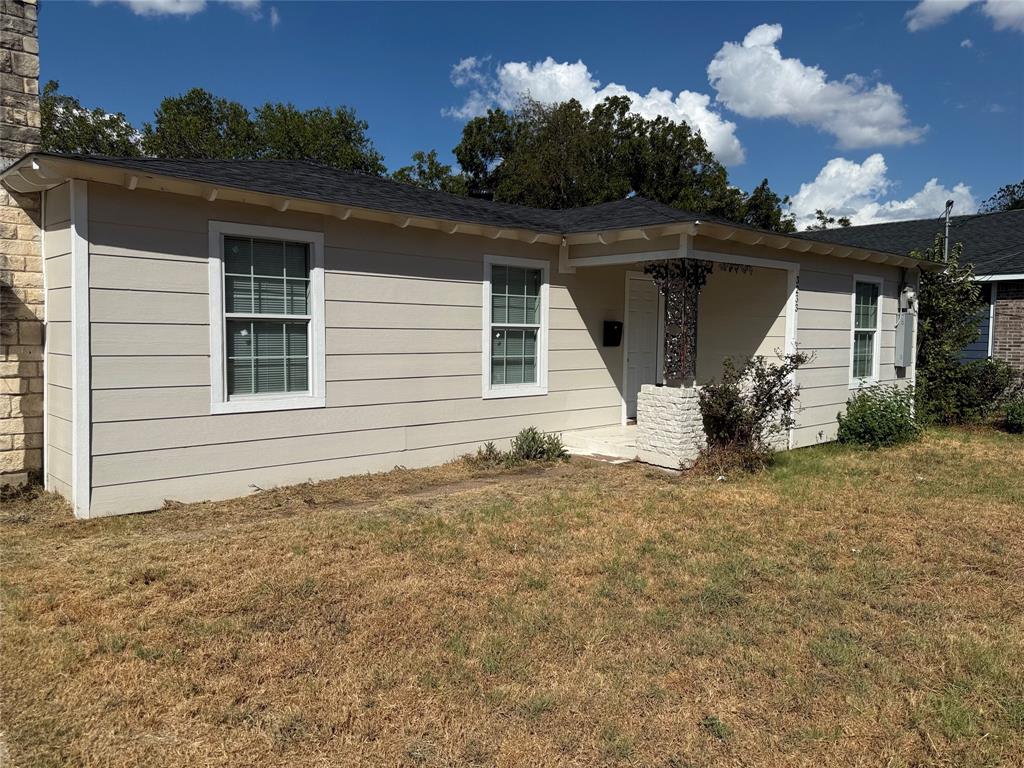 3233 Springview Avenue Dallas, TX 75216 - Photo 2 of 11 Single-story residence featuring horizontal siding, a dark shingle roof, and white window frames