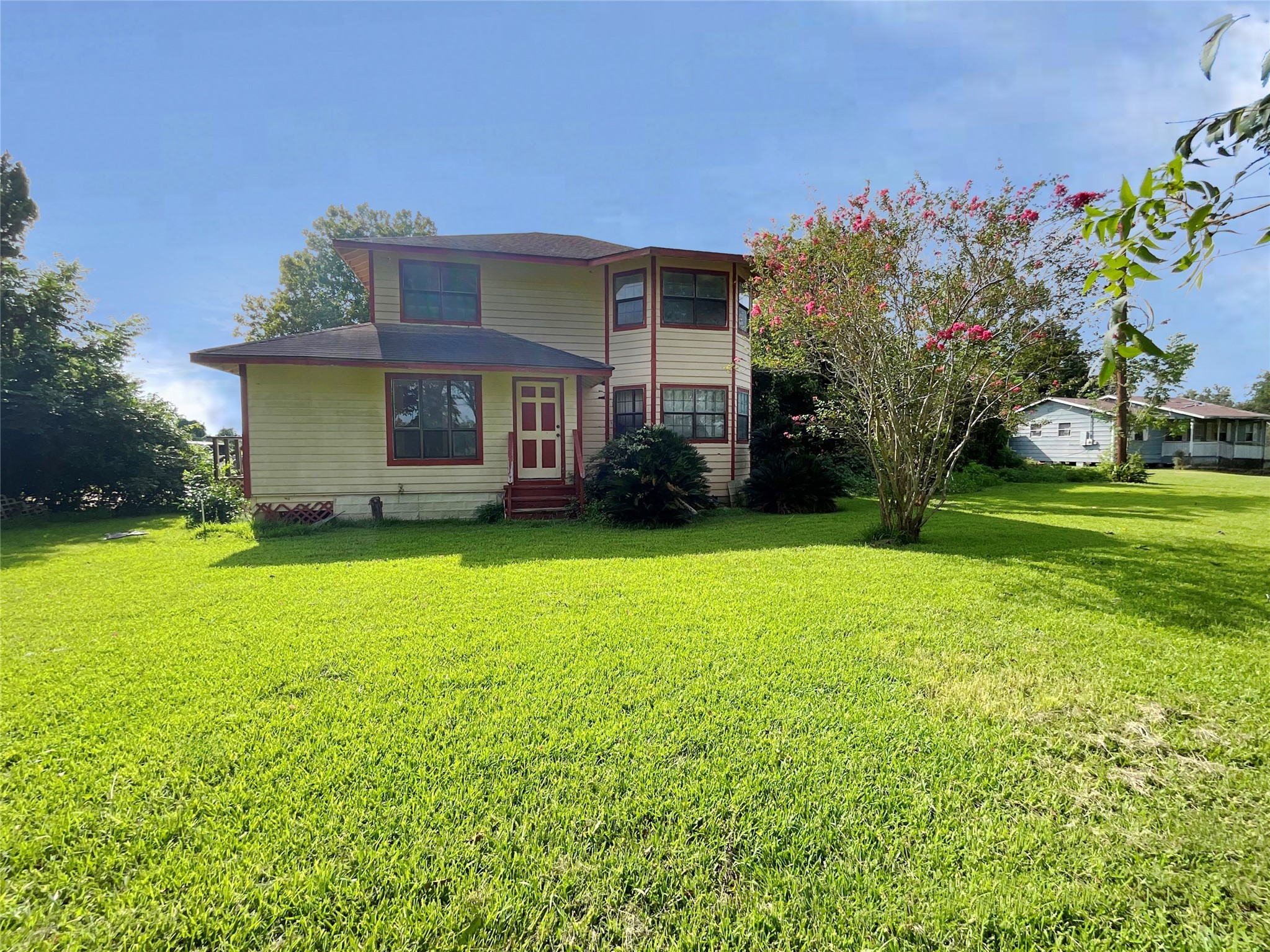 a front view of a house with garden