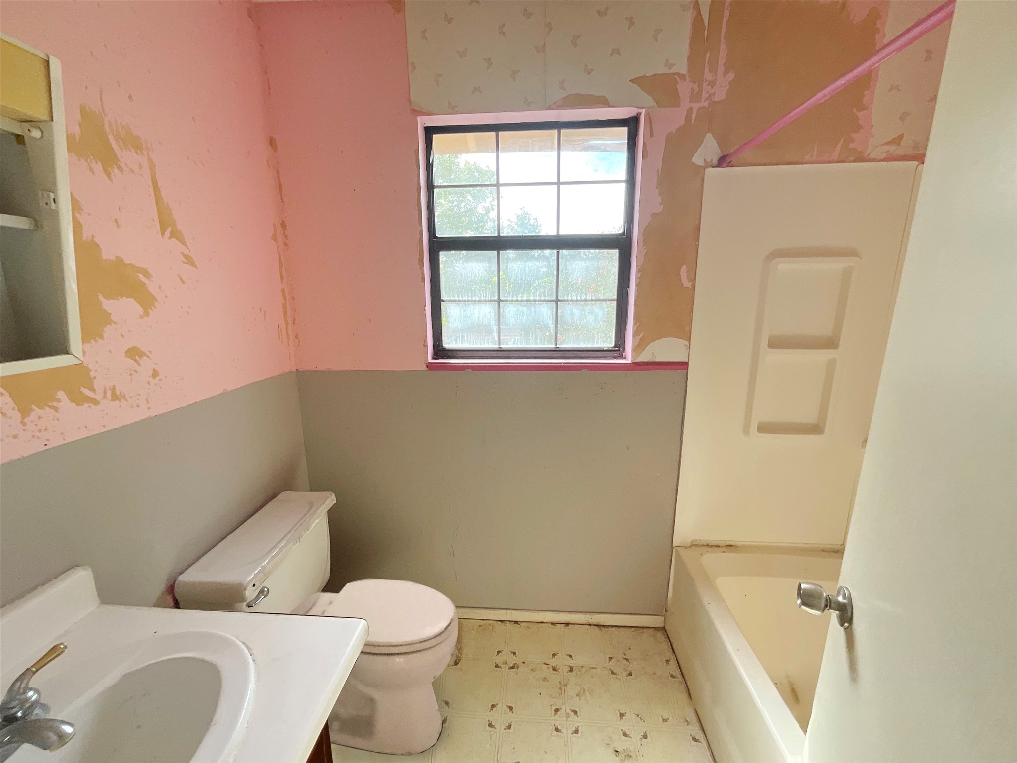 1571 FM 640 Road Wharton, TX 77488 - Photo 13 of 15 a white toilet sitting next to a bathroom sink and a window