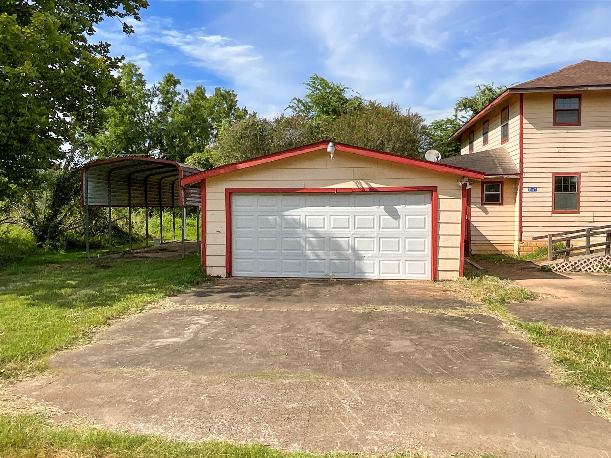 1571 FM 640 Road Wharton, TX 77488 - Photo 3 of 15 a front view of a house with a yard and garage