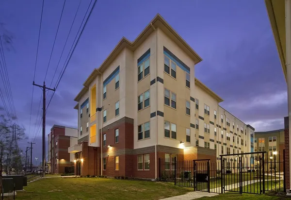 a view of a building with a yard