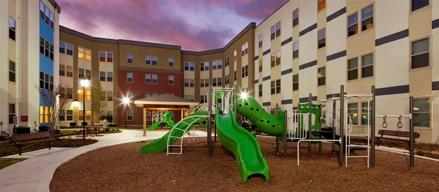 a view of a building with a yard