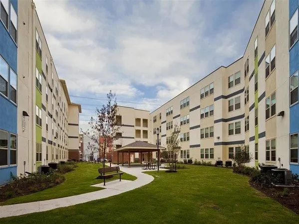 a view of a building with a yard