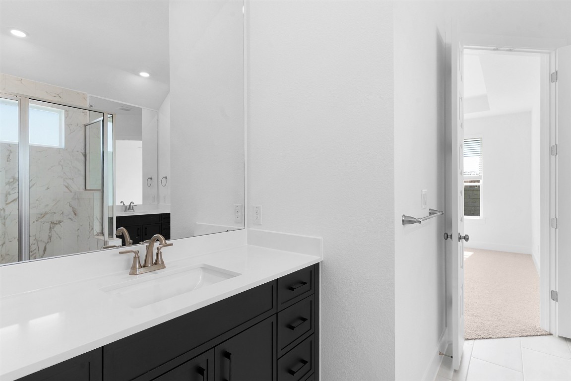 1129 Pansy Trail Georgetown, TX 78628 - Photo 17 of 28 a bathroom with a sink and a mirror