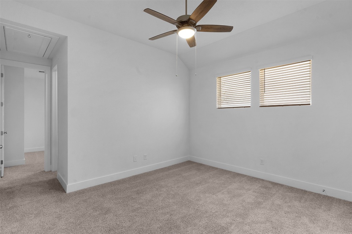 1129 Pansy Trail Georgetown, TX 78628 - Photo 4 of 28 an empty room with a window and a fan